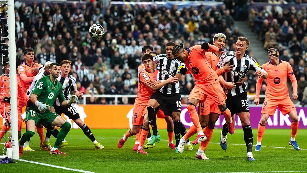 | Photo: AP/Owen Humphreys : Barcelona's Raphael Raphinha, center, clears the ball during the Champions League round of 16 first leg soccer match between Newcastle United and Barcelona in Newcastle, England, Tuesday, March 10, 2026. 