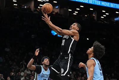 | Photo: AP/Frank Franklin II : Brooklyn Nets Ochai Agbaji (30) drives past Memphis Grizzlies Jaylen Wells (0) and Olivier-Maxence Prosper during the first half of an NBA basketball game in New York.