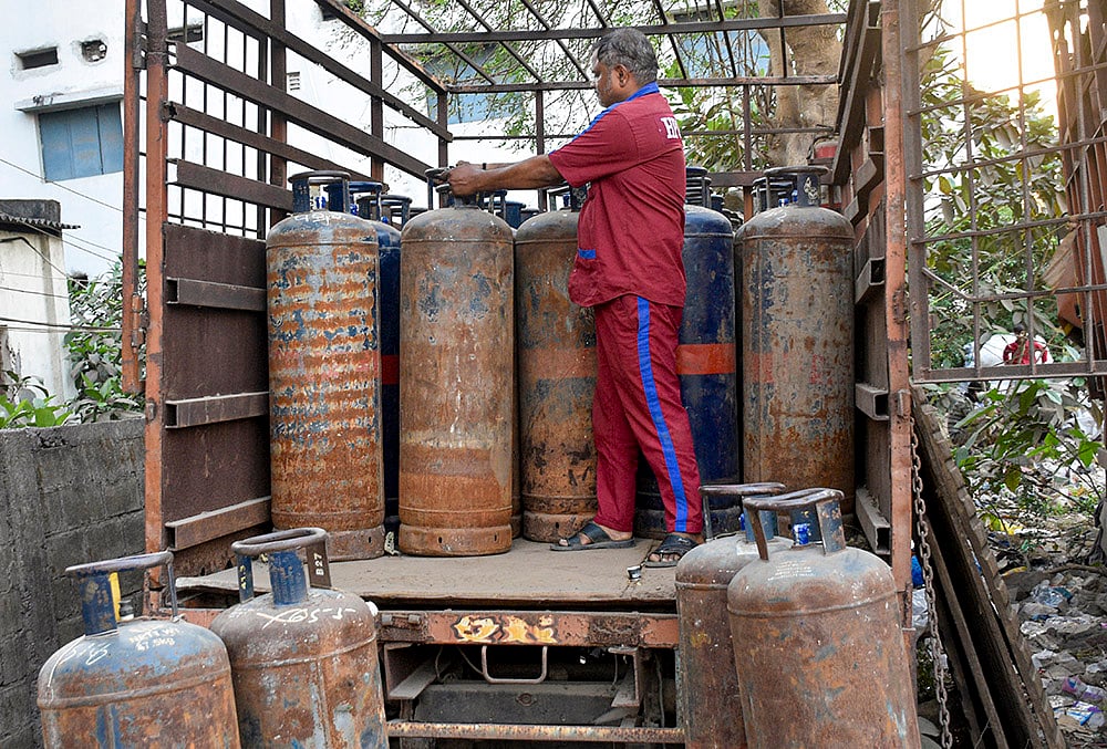 | Photo: PTI : A worker arranges commercial LPG cylinders on a vehicle amid a shortage of cooking gas, in Saroli area of Surat, Gujarat, Tuesday, March 10, 2026. The shortage follows disruptions in LPG supplies linked to the ongoing West Asia conflict affecting global energy supply chains. 