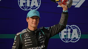 | Photo: AP/Andy Wong : Mercedes driver George Russell of Britain celebrates his pole position for the sprint qualifying ahead of the Chinese Formula One Grand Prix race in Shanghai, China, Friday, March 13, 2026.