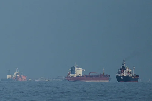 Credit: AP Photo/ Altaf Qadri | Representative Image : Oil tankers and cargo ships line up in the Strait of Hormuz as seen from Khor Fakkan, United Arab Emirates, Wednesday, March 11, 2026