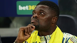 | Photo: AP/Ian Walton : Villarreal's Thomas Partey sits on the bench during the Champions League soccer match between Tottenham and Villarreal in London, Tuesday, Sept. 16, 2025.