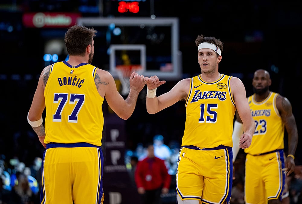 | Photo: AP/Ethan Swope : Los Angeles Lakers guard Luka Doncic (77) and Los Angeles Lakers guard Austin Reaves (15) celebrate during the second half of an NBA basketball game in Los Angeles. 