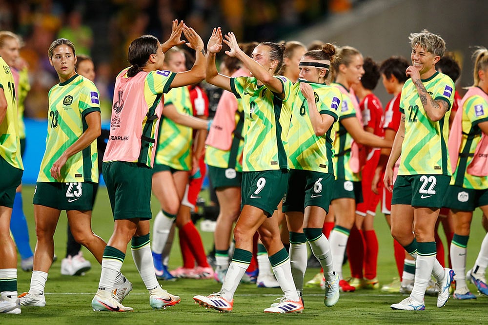 | Photo: AP/Gary Day : Australias Sam Kerr and teammate Australias Caitlin Foord celebrate following the Womens Asian Cup quarterfinal soccer match between Australia and North Korea in Perth, Australia.
