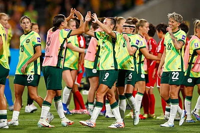 | Photo: AP/Gary Day : Australias Sam Kerr and teammate Australias Caitlin Foord celebrate following the Womens Asian Cup quarterfinal soccer match between Australia and North Korea in Perth, Australia.