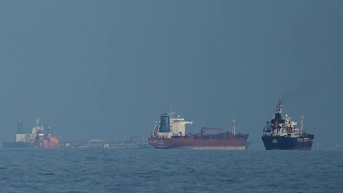 Credit: AP Photo/ Altaf Qadri | Representative Image : Oil tankers and cargo ships line up in the Strait of Hormuz as seen from Khor Fakkan, United Arab Emirates, Wednesday, March 11, 2026