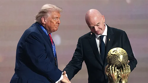 (AP Photo/Stephanie Scarbrough, Pool, File_) : FILE - FIFA President Gianni Infantino presents President Donald Trump with the FIFA Peace Prize during the draw for the 2026 soccer World Cup at the Kennedy Center in Washington, Friday, Dec. 5, 2025.