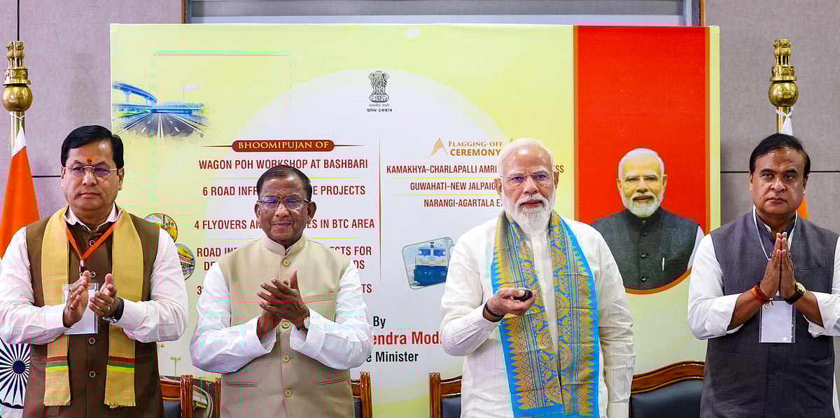 In this image received on March 13, 2026, Prime Minister Narendra Modi lays the foundation stone and unveils various development works in Kokrajhar, Assam. Union Minister Sarbananda Sonowal, state Governor Lakshman Acharya, state CM Himanta Biswa Sarma also seen.