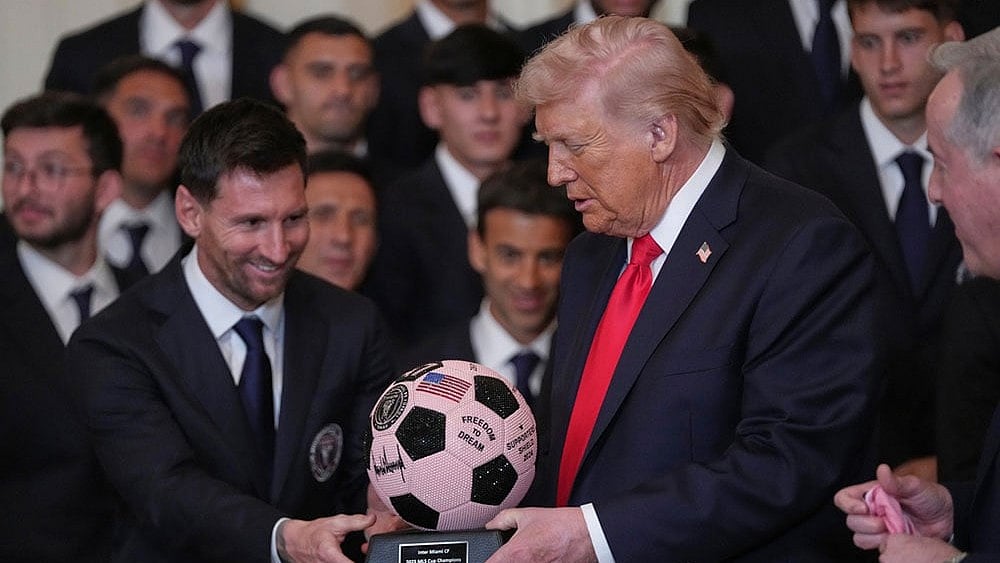 Photo: AP/Julia Demaree Nikhinson : President Donald Trump receives a soccer ball trophy from Lionel Messi during an event to honor the 2025 Major League Soccer champions Inter Miami in the East Room of the White House in Washington.