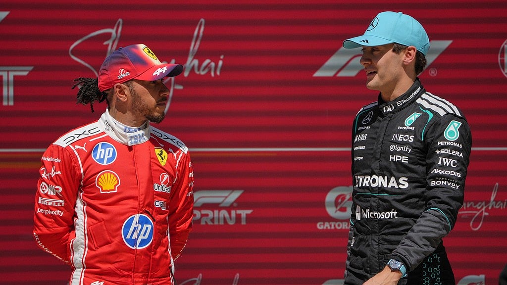 AP Photo/Andy Wong : Winner Mercedes driver George Russell, right, of Britain talks with third placer Ferrari driver Lewis Hamilton of Britain after the Sprint Race of the Chinese Formula One Grand Prix at the Shanghai International Circuit, in Shanghai, China, Saturday, March 14, 2026.