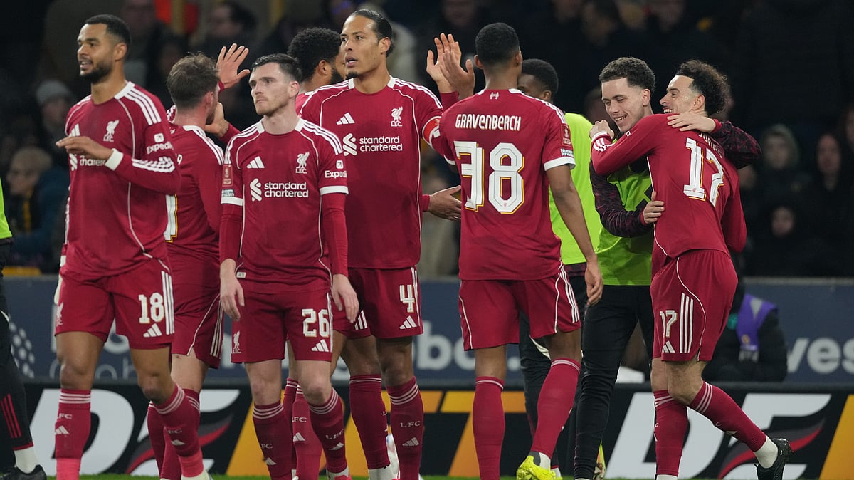 | Photo: AP/Dave Shopland : Liverpool's Curtis Jones, right, celebrates with teammates after scoring during the English FA Cup soccer match between Wolves and Liverpool in Wolverhampton, England, Friday, March 6, 2026.