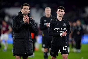 | Photo: Bradley Collyer/PA via AP : Manchester City's Bernardo Silva,left,and Phil Foden applaud the fans after a Premier League soccer match against West Ham United in London.