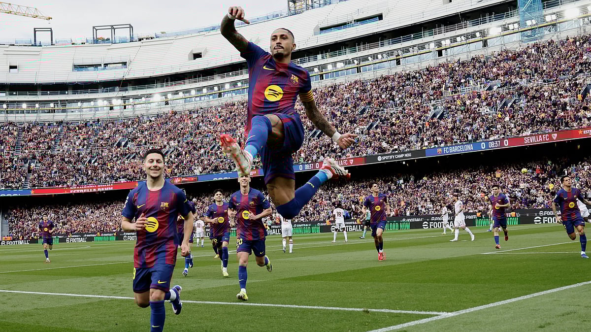 | Photo: AP/Joan Monfort : Barcelona's Raphinha celebrates after scoring his side's opening goal during the Spanish La Liga soccer match between Barcelona and Sevilla in Barcelona, Spain, Sunday, March 15, 2026.