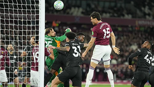 AP/Dave Shopland : Konstantinos Mavropanos (15) scores his sides first goal during the English Premier League soccer match between West Ham United and Manchester City in London.