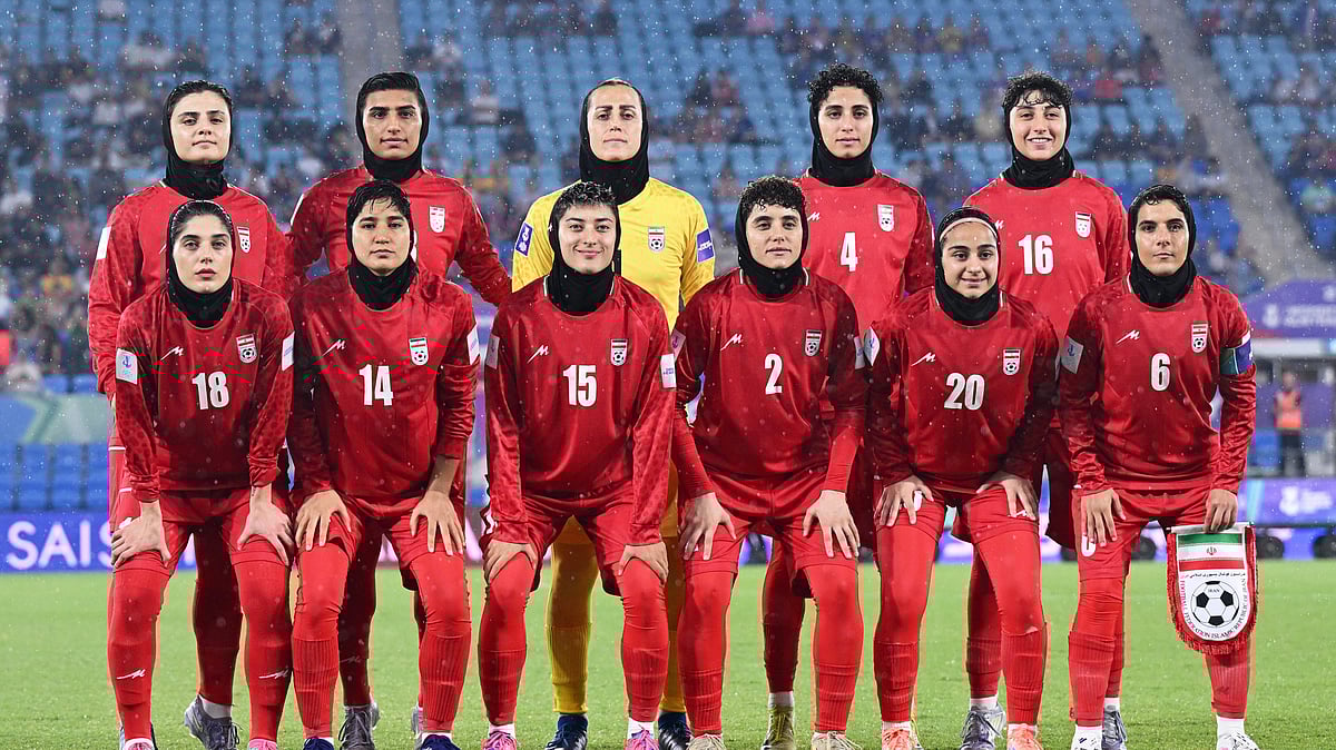 (Dave Hunt/AAPImage via AP,File) : FILE - Iran players pose for a team photo ahead of the Womens Asian Cup soccer match between Iran and the Philippines in Robina, Australia, Sunday, March 8, 2026.