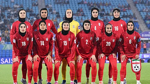 (Dave Hunt/AAPImage via AP,File) : FILE - Iran players pose for a team photo ahead of the Womens Asian Cup soccer match between Iran and the Philippines in Robina, Australia, Sunday, March 8, 2026.