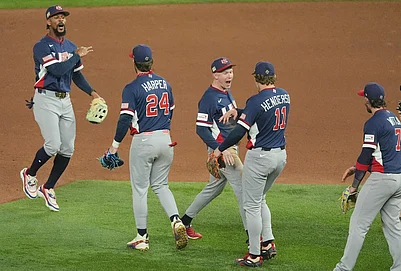 | Photo: AP/Rebecca Blackwell : The United States team celebrates after defeating the Dominican Republic at a World Baseball Classic semifinal game in Miami.