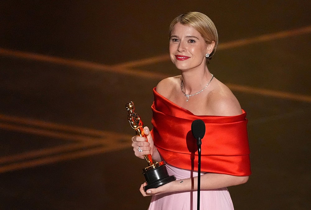 | Photo: AP/Chris Pizzello : Jessie Buckley accepts the award for actress in a leading role for Hamnet during the Oscars at the Dolby Theatre in Los Angeles. 