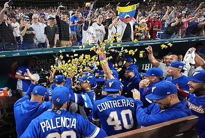 | Photo: AP/Lynne Sladky : Venezuela team celebrate their victory over Japan after a World Baseball Classic quarterfinal game in Miami.