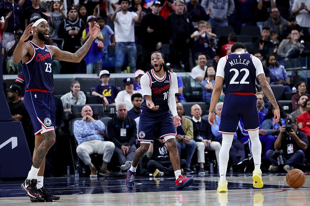 | Photo: AP/Ryan Sun : Los Angeles Clippers guard Darius Garland, center, reacts with forward Isaiah Jackson, left, and guard Jordan Miller after a call during the second half of an NBA basketball game against the San Antonio Spurs  in Inglewood, Calif.