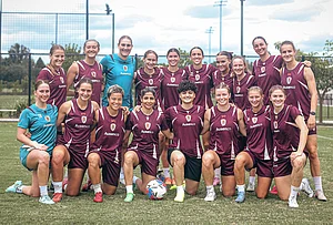 | Photo: Brisbane Roar via AP : Iranian soccer player's Fatemeh Pasandideh, fourth from right at front row, and Atefeh Ramezanisadeh, fourth from left at front row, pose for a photo with the Brisbane Roar women's A-League team at a training session in Brisbane, Australia.