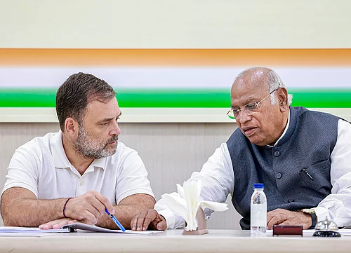 | Photo: AICC via PTI : Congress President and LoP in the Rajya Sabha Mallikarjun Kharge interacts with LoP in the Lok Sabha Rahul Gandhi during a Congress Central Election Committee (CEC) meeting for Kerala, in New Delhi.
