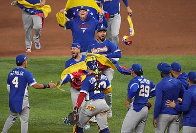 | Photo: AP/Lynne Sladk : The Venezuela team celebrates after defeating Italy at a World Baseball Classic semifinal game in Miami.