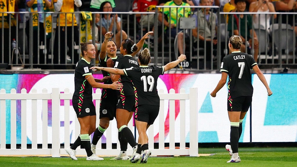 AP : Sam Kerr, second left, is congratulated by teammates after scoring her team's second goal during the Women's Asian Cup semi-final between China and Australia in Perth, Australia.