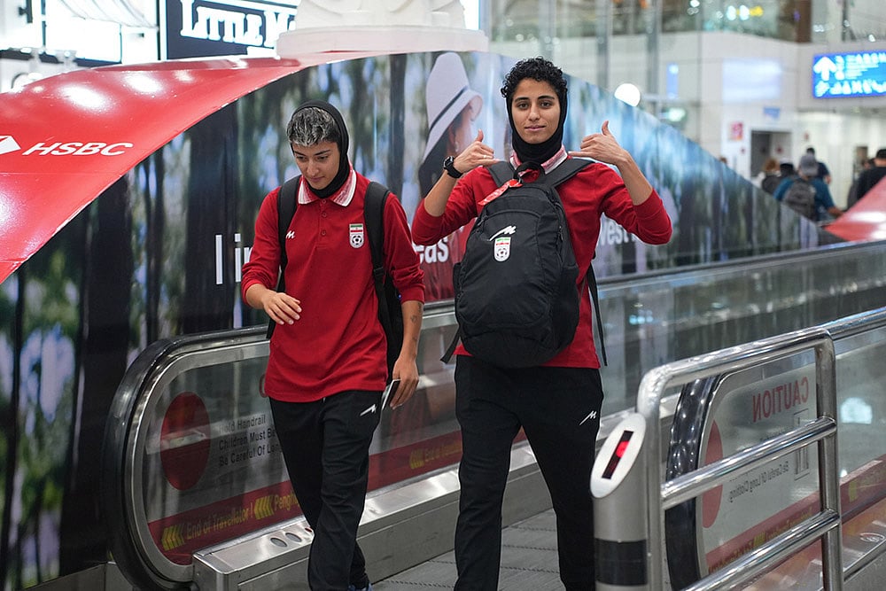 | Photo: AP/Azneal Ishak : Members of Irans womens football team arrive at the Kuala Lumpur International Airport in Sepang, Malaysia.