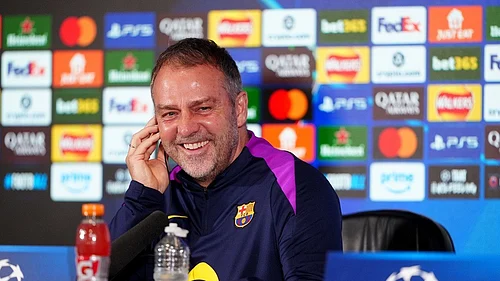 AP Photo : Barcelona manager Hansi Flick smiles during a press conference at St. James Park, Newcastle upon Tyne, England, Monday March 9, 2026, ahead of the Champions League soccer match between Newcastle United and Barcelona on Tuesday.