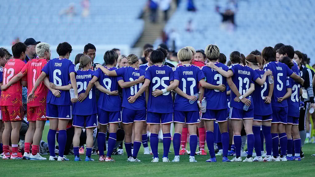 AP : Japan players gather on the pitch following their AFC Women's Asian Cup quarter-final win over the Philippines in Sydney.