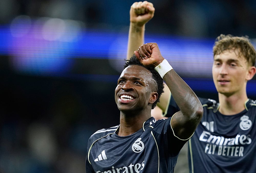 | Photo: AP/Dave Thompson : Real Madrids Vinicius Junior celebrates after the Champions League round of 16 second leg soccer match between Manchester City and Real Madrid in Manchester.