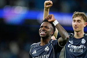 | Photo: AP/Dave Thompson : Real Madrid's Vinicius Junior celebrates after the Champions League round of 16 second leg soccer match between Manchester City and Real Madrid in Manchester.