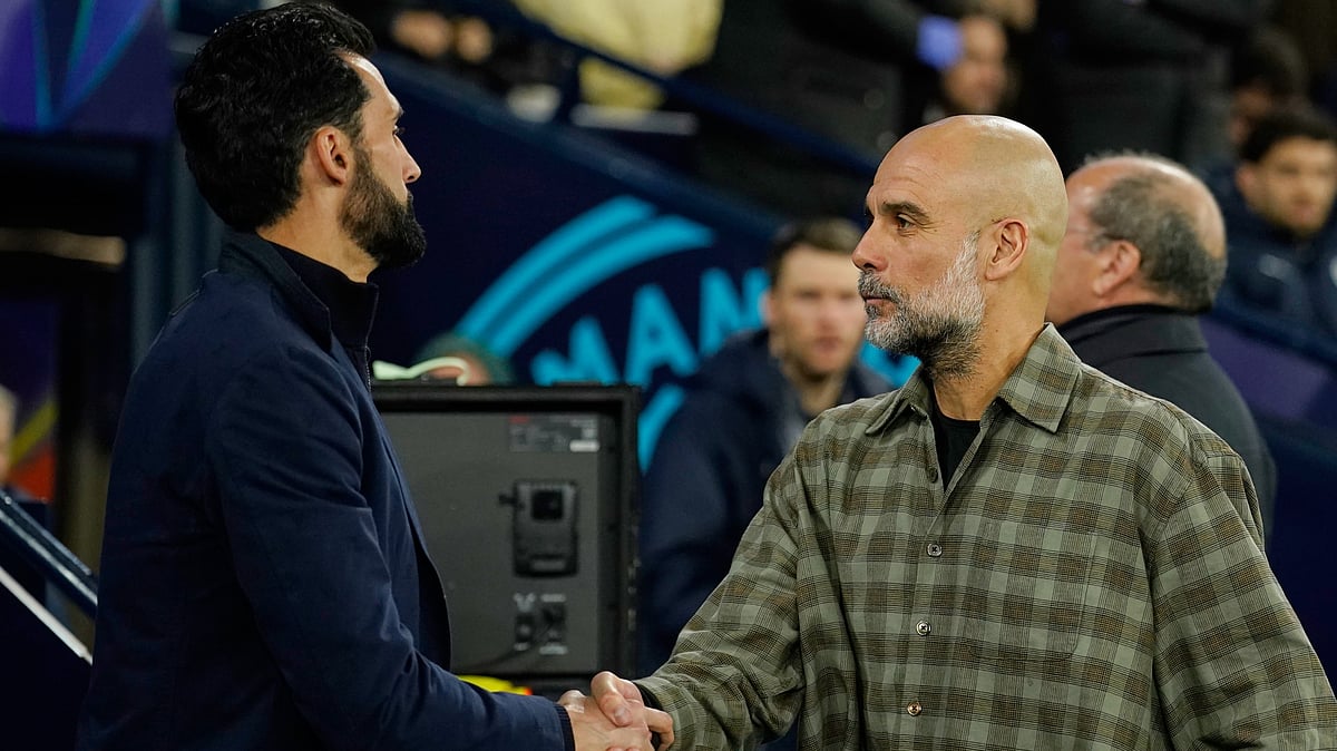 | Photo: AP/Dave Thompson : Real Madrid's head coach Alvaro Arbeloa shakes hands with Manchester City's head coach Pep Guardiola ahead of the Champions League round of 16 second leg soccer match between Manchester City and Real Madrid in Manchester, Tuesday, March 17, 2026.