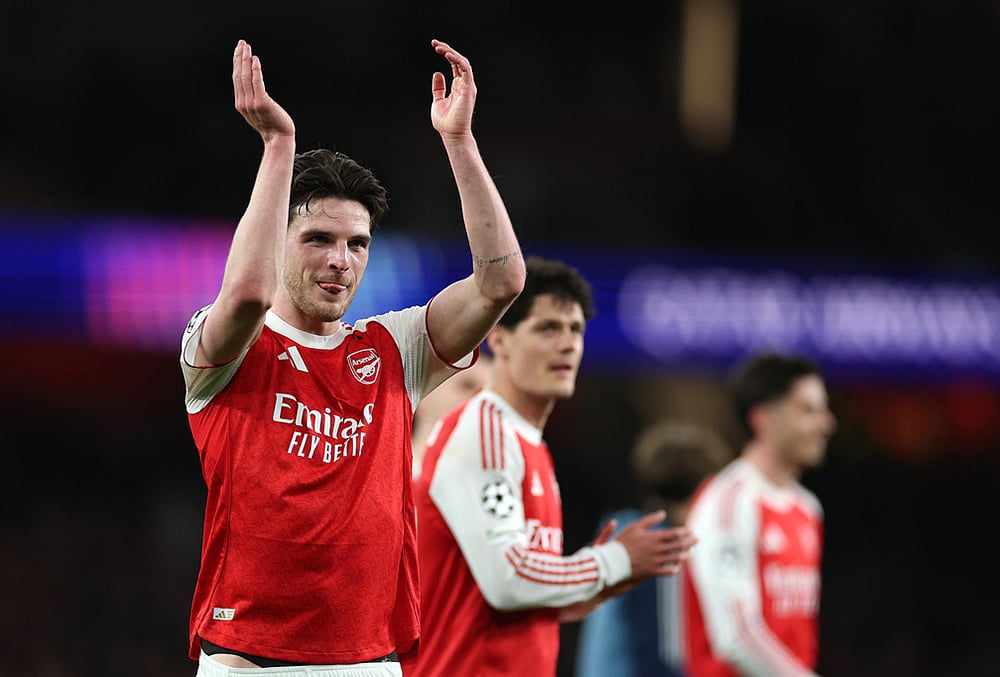 | Photo: AP/Ian Walton : Arsenals Declan Rice celebrates after winning the second leg of the Champions League round of 16 soccer match between Arsenal and Bayer Leverkusen, in London.