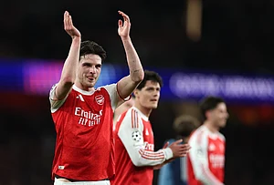 | Photo: AP/Ian Walton : Arsenal's Declan Rice celebrates after winning the second leg of the Champions League round of 16 soccer match between Arsenal and Bayer Leverkusen, in London.