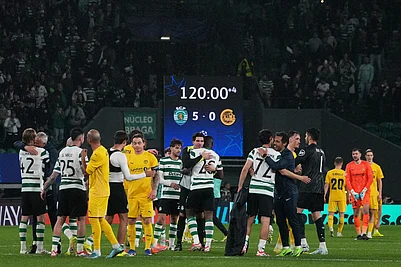 | Photo: AP/Ana Brigida : Players greet after a Champions League round of 16 second leg soccer match between Sporting CP and Bodo Glimt in Lisbon, Portugal.