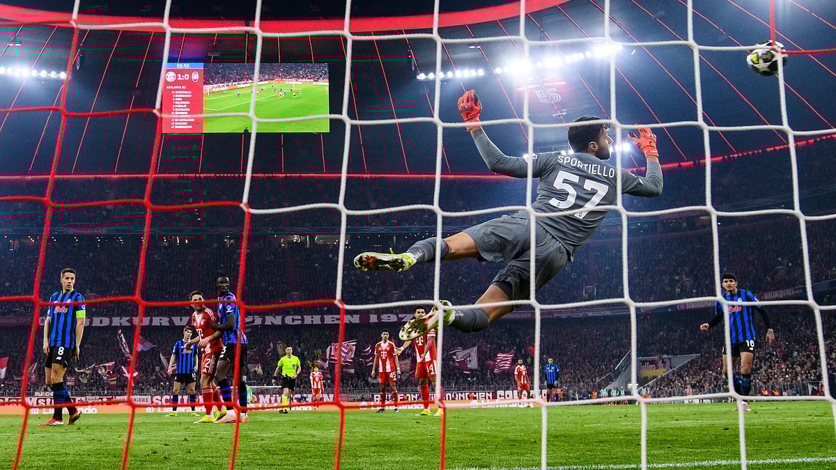| Photo: AP/Tom Weller : Bayern Munichs Harry Kane scores to make it 2-0 against Atalanta Bergamos Marco Sportiello, Wednesday, March 18, 2026, in Munich, Germany.
