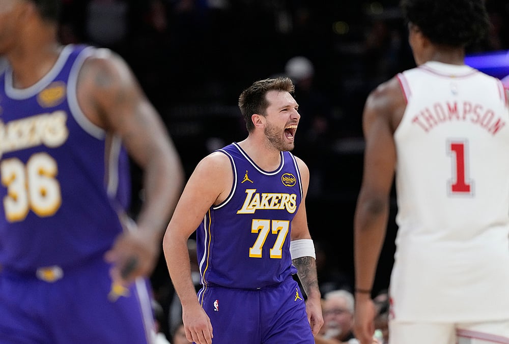 | Photo: AP/David J. Phillip : Los Angeles Lakers Luka Doncic (77) celebrates after making a basket against the Houston Rockets during the second half of an NBA basketball game in Houston. 