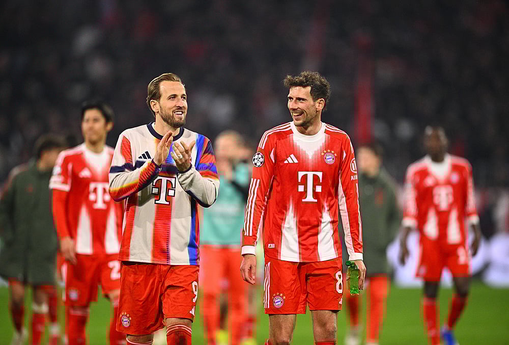 | Photo: Tom Weller/dpa via AP : Bayern Munichs Harry Kane and Leon Goretzka react after a match against Atalanta Bergamo in Munich, Germany.