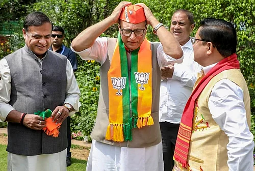 PTI : On March 18, Assam Chief Minister Himanta Biswa Sarma, left, and BJP Assam president Dilip Saikia, right, welcome Nagaon MP Pradyut Bordoloi into the Bharatiya Janata Party, in New Delhi.