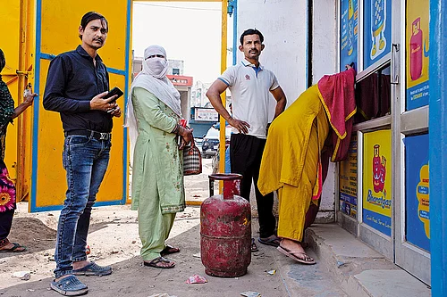| Photo: Vikram Sharma : A Long Wait: People queue up for LPG cylindars in Badhkal, rural Faridabad