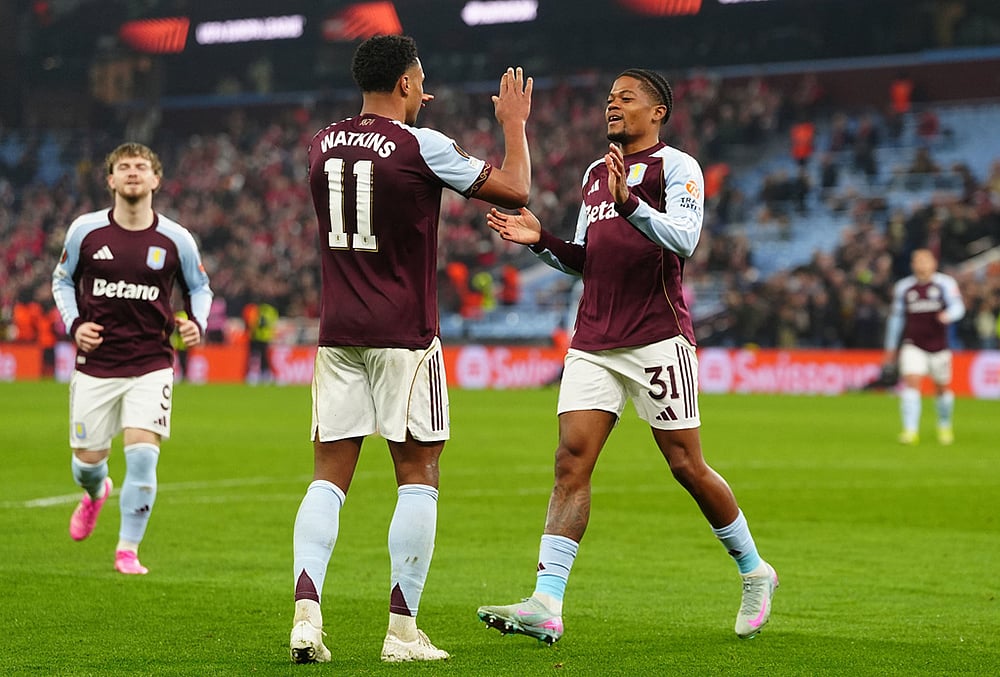 | Photo: David Davies/PA via AP : Aston Villas Leon Bailey, right, celebrates with his teammate Ollie Watkins after scoring his sides second goal during the Europa League round of sixteen second leg soccer match between Aston Villa and LOSC Lille in Birmingham, England.