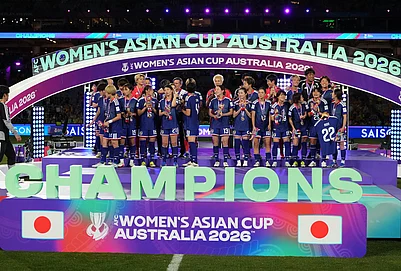 | Photo: AP/Mark Baker : Japanese players pose after winning against Australia at Womens Asian Cup soccer final in Sydney.