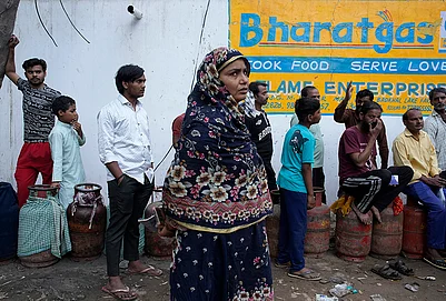 | Photo: Vikram Sharma : Residents of Badhkal in rural Faridabad, line up and wait at a distribution agency for LPG cylinders