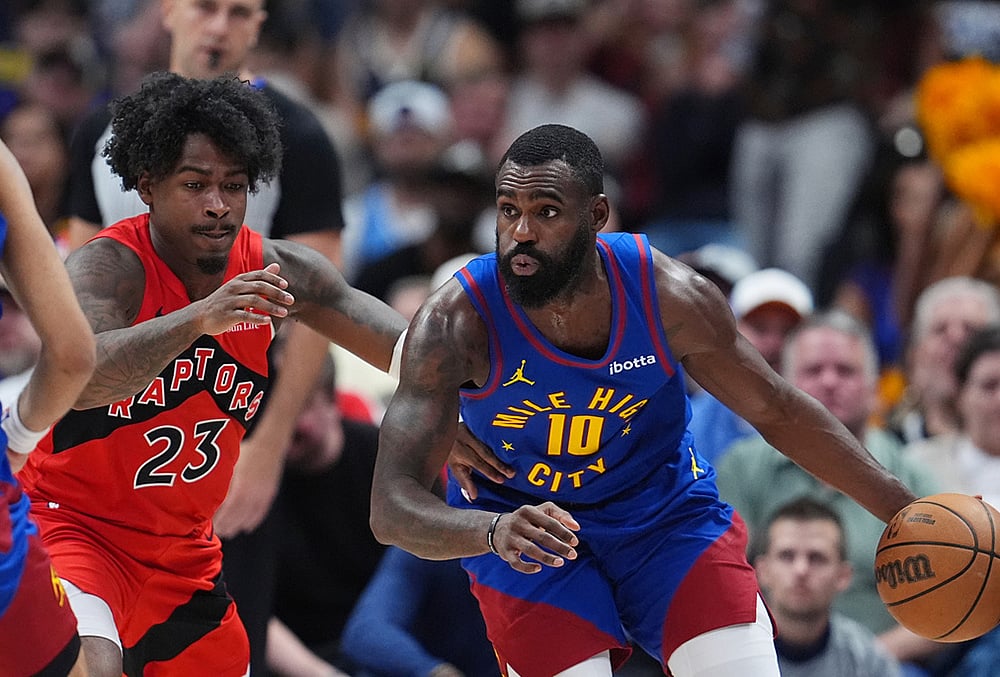 | Photo: AP/David Zalubowski : Denver Nuggets guard Tim Hardaway Jr., right, drives past Toronto Raptors guard Jamal Shead in the second half of an NBA basketball game in Denver. 