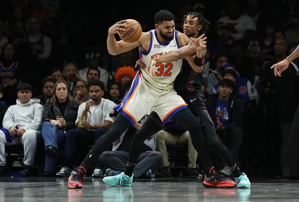 | Photo: AP/Heather Khalifa : New York Knicks center Karl-Anthony Towns (32) is defended by Brooklyn Nets center Nic Claxton during the first half of an NBA basketball game in New York. 