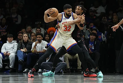 | Photo: AP/Heather Khalifa : New York Knicks center Karl-Anthony Towns (32) is defended by Brooklyn Nets center Nic Claxton during the first half of an NBA basketball game in New York.