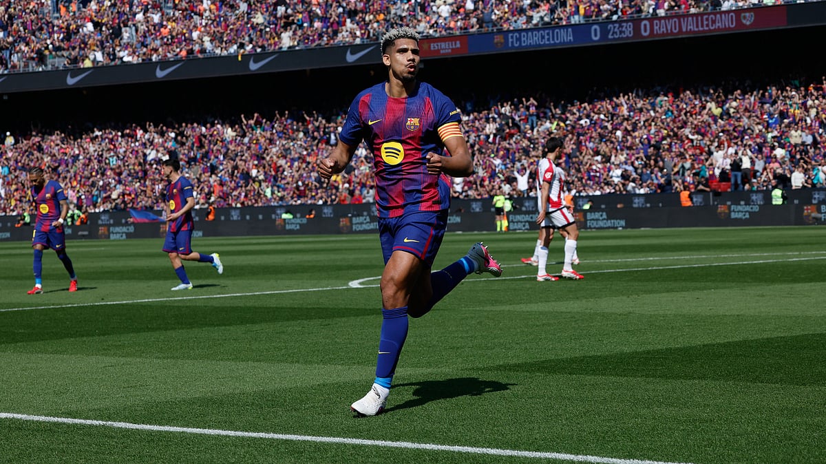 | Photo: AP/Joan Monfort : Barcelona's Ronald Araujo celebrates after scoring during a La Liga soccer match between Barcelona and Rayo Vallecano in Barcelona, Spain, Sunday, March 22, 2026.