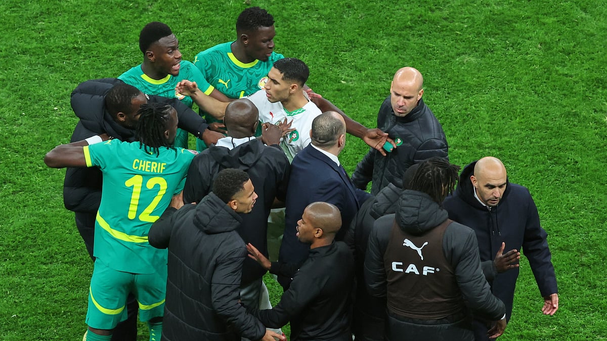 | Photo: AP/Youssef Loulidi : Moroccos Achraf Hakimi, center, clashes with Senegal players after a controversial penalty was awarded to Morocco late on during the Africa Cup of Nations final soccer match between Senegal and Morocco in Rabat, Morocco, Sunday, Jan. 18, 2026.
